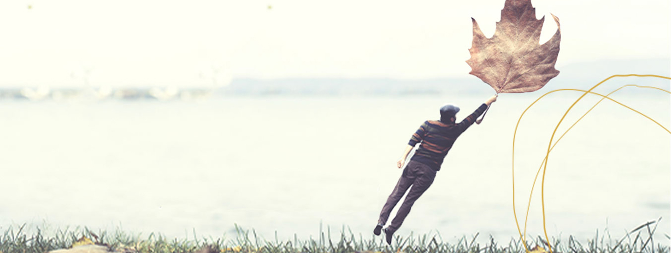 Risk and Uncertainty - Man hanging on leave floating